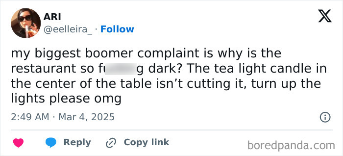 Tweet from a young person sharing a boomer complaint about restaurant lighting and tea light candles.