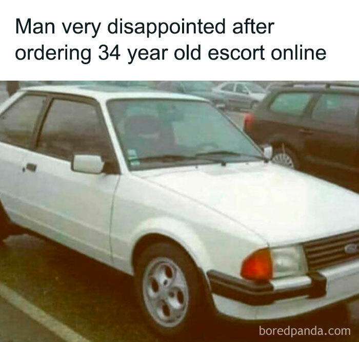 White vintage car parked in a lot, humorously linked to celebrating the good old 80s on an IG account.