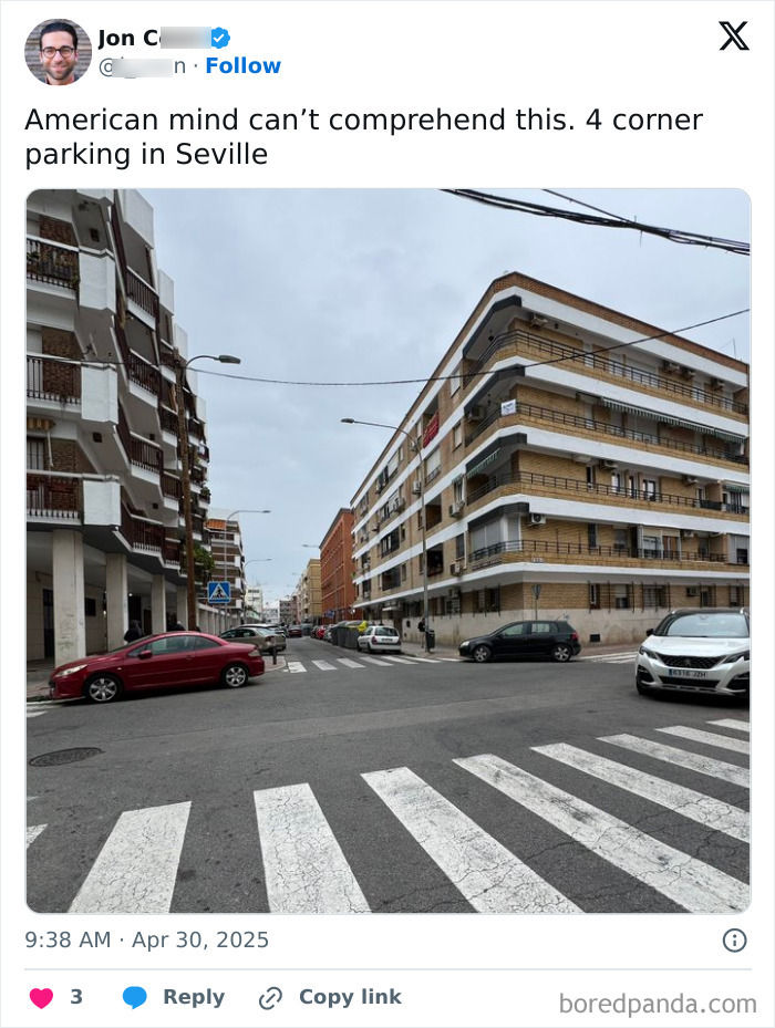 Four cars parked at a four-corner intersection in Seville, illustrating a confusing scene for the American mind.