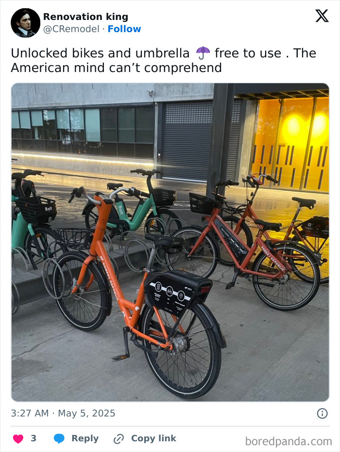 Unlocked public bikes parked with an umbrella stand in an urban area, highlighting the American mind confusion concept.