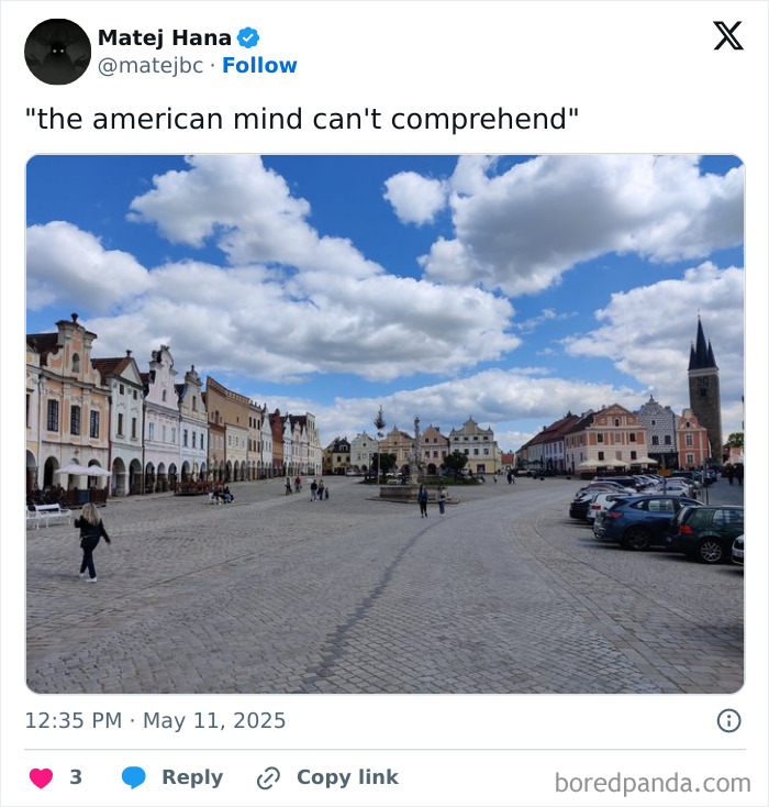 Historic European town square with colorful buildings and cloudy sky, a scene to confuse the American mind.