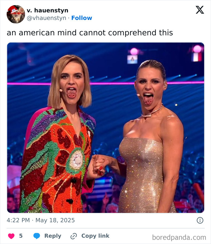 Two women on stage making unusual facial expressions, illustrating confusion to challenge the American mind comprehension.