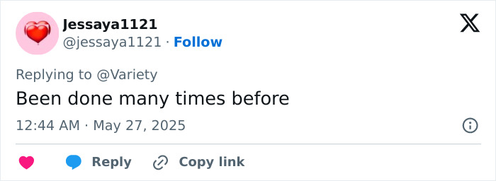 Social media reply mentioning Jennifer Lopez gets roasted for lesbian kiss during the AMAs in a brief comment.