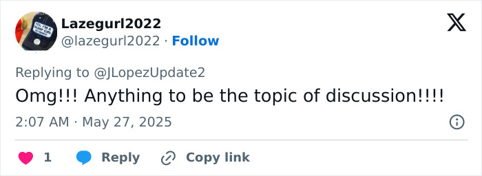 Twitter reply from Lazegurl2022 reacting to Jennifer Lopez getting roasted for lesbian kiss during the AMAs.