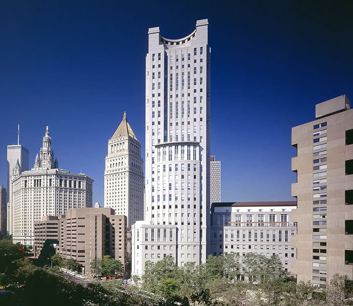 Skyscraper courthouse building under clear blue sky related to Diddy case and alleged victim testimony news.