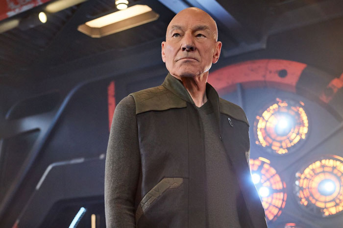 Actor standing in a futuristic setting, representing a celebrity encounter from stories that went really well or terribly bad.