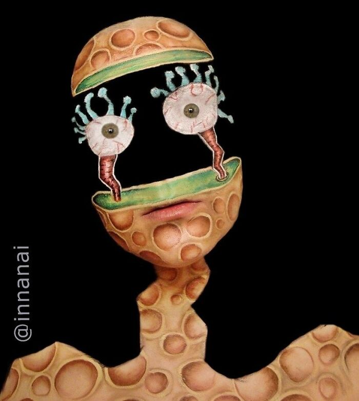 Surreal makeup look with peeled back cheese-like skin and exaggerated eyeballs for incredible makeup looks by talented artists.