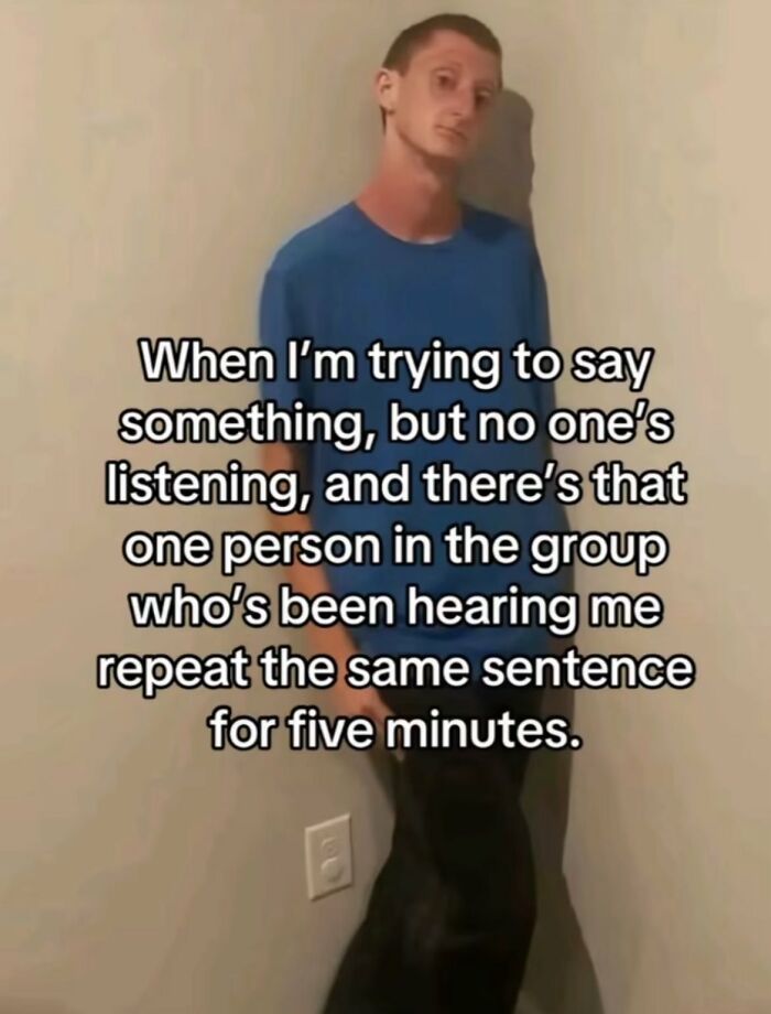 Young man in blue shirt leaning against wall with text about repeating sentences, representing chaotic memes humor in daily life.