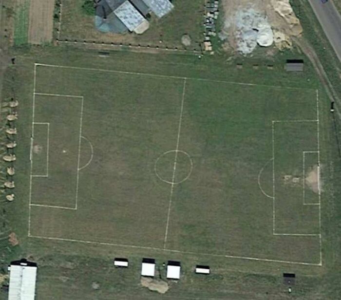 Aerial view of a soccer field showing odd markings visible on Google Earth in a surprising discovery.