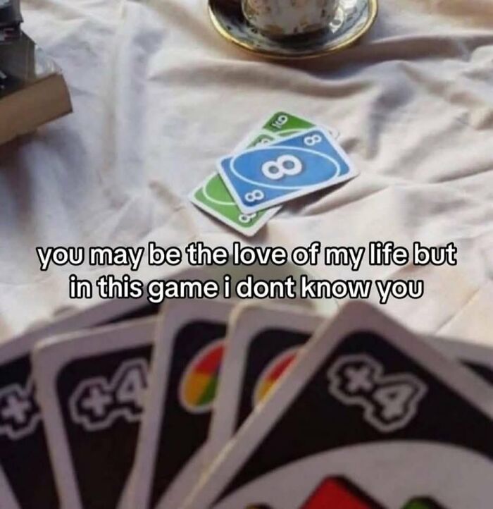 Chaotic meme showing UNO cards with caption about ignoring love during the game, perfect for when life gets boring.
