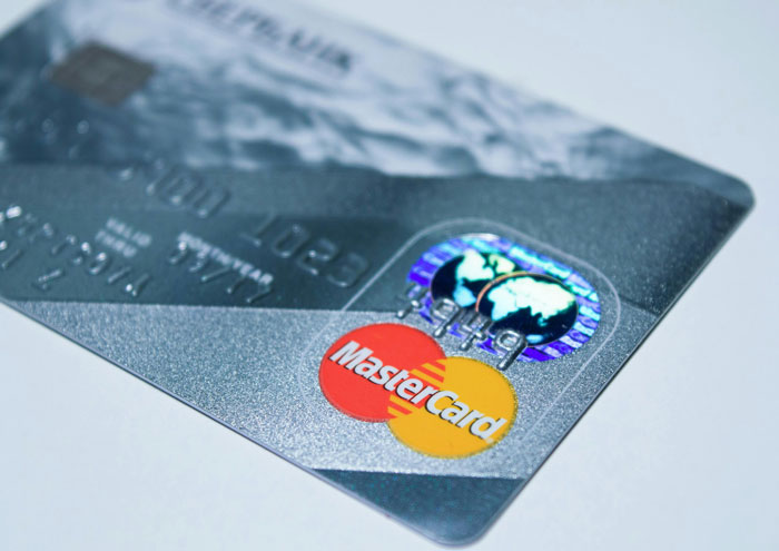 Close-up of a Mastercard credit card symbolizing financial secrets spouses may keep until after they are married.