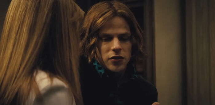 Two actors in a dimly lit scene, representing miscast actors who almost ruined the movies they were in.