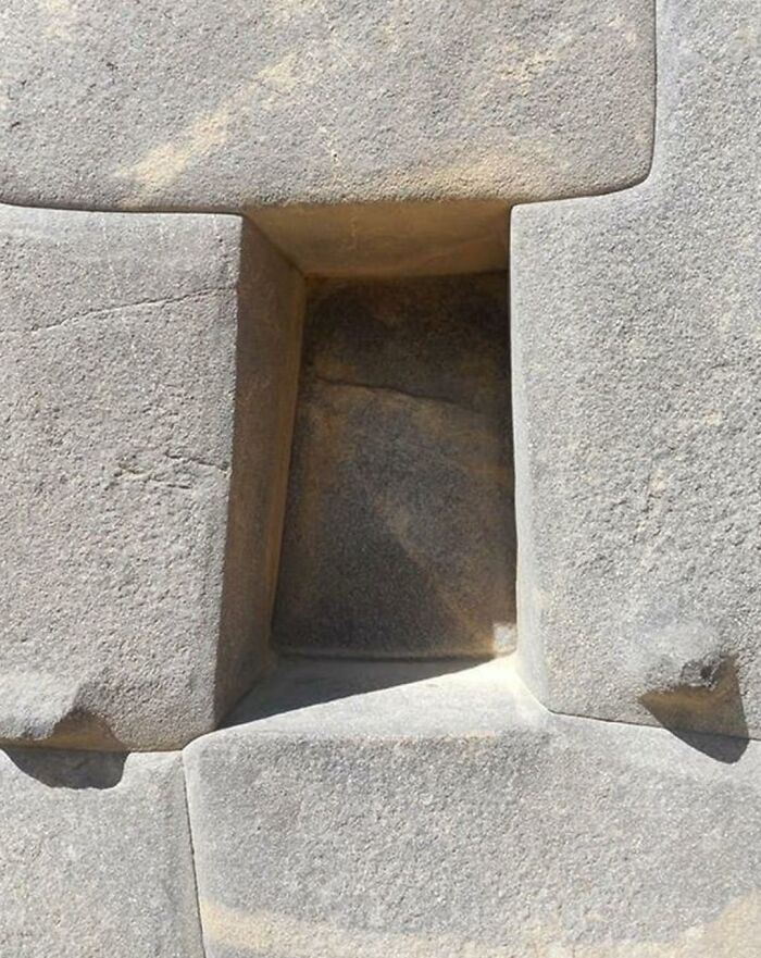 Ancient stone masonry with precise interlocking blocks showing craftsmanship from ancient history sites.