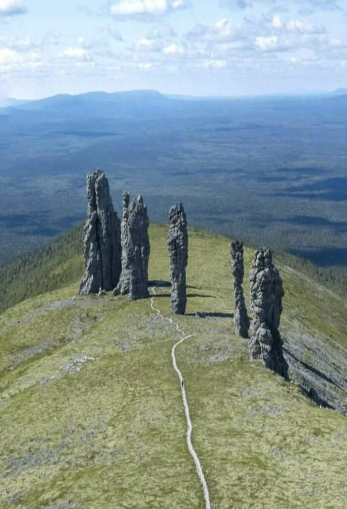 Tall natural rock formations on a mountain ridge, an odd geological formation spotted on Google Earth sightings.