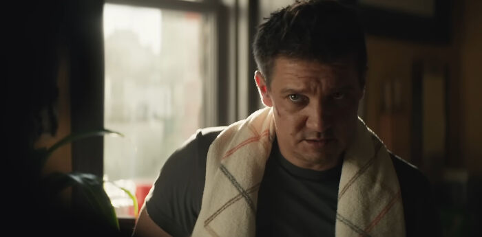 Actor looking intense indoors with a towel over his shoulders, representing miscast actors in popular movies.