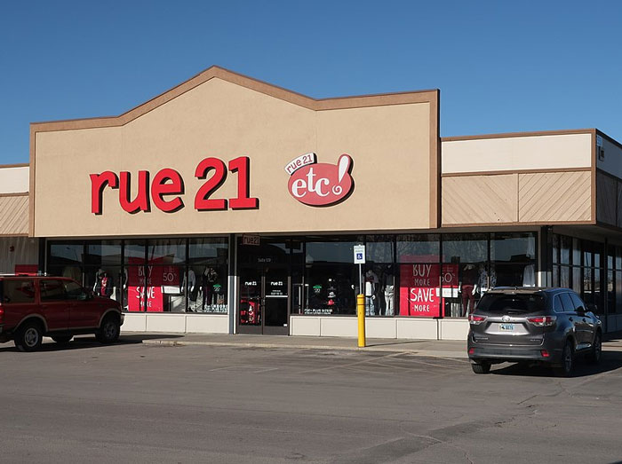 Former employees outside a rue 21 retail store revealing disturbing workplace secrets after quitting their jobs.