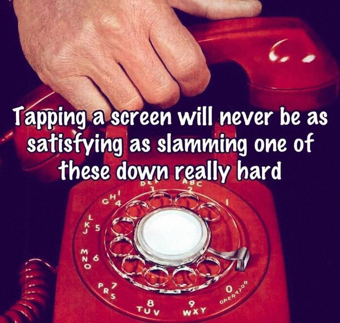 Close-up of hand slamming a red rotary phone, celebrating retro moments from the good old 80s.
