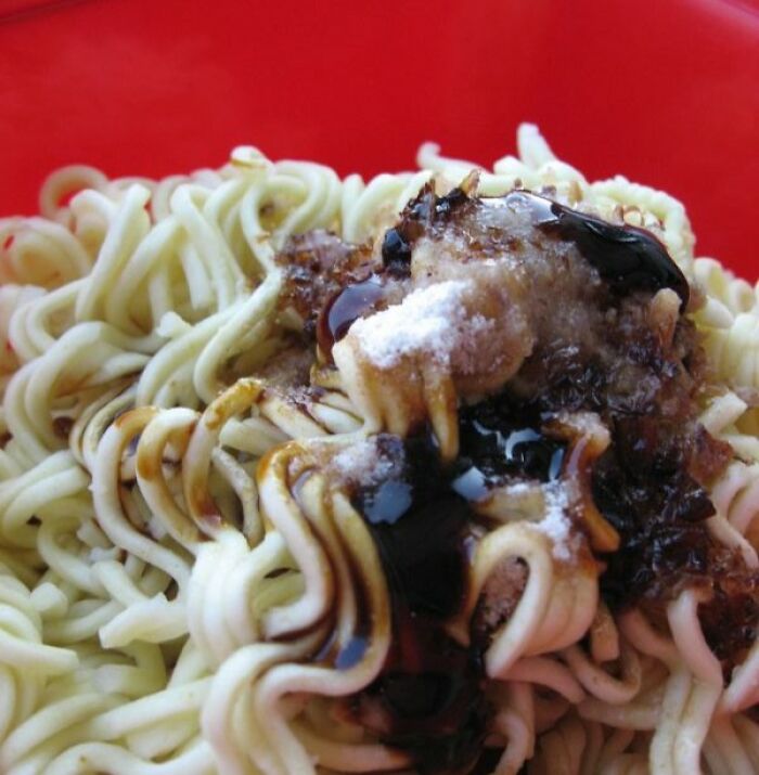 Close-up of noodles topped with unusual condiments illustrating wild cooking opinions that sparked internet discussions.