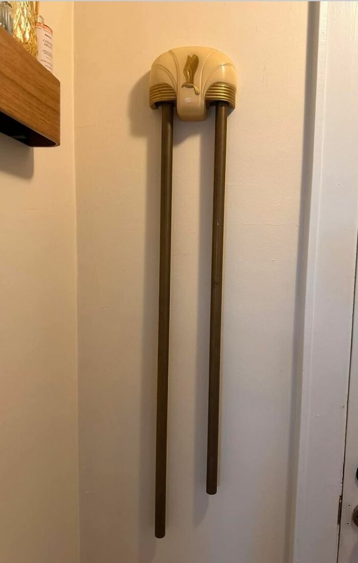 Vintage wooden strange thing with decorative top, found in homes with hidden, forgotten, or haunted pasts.