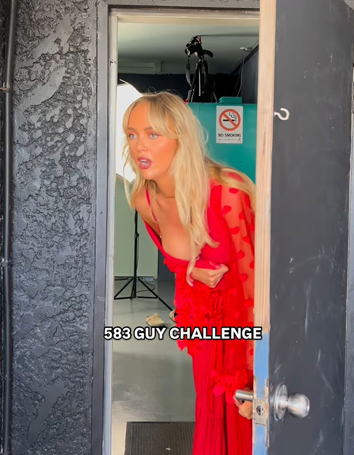 Adult content creator in a red dress shares hospital update about bleeding after intense 583 men challenge in six hours.
