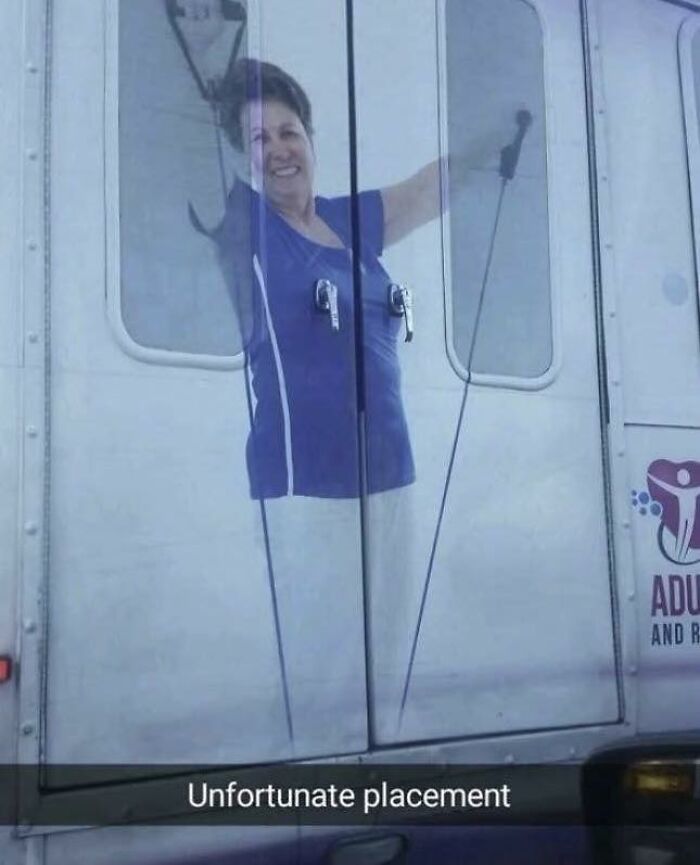 Woman image on a truck door with unfortunate placement creating a humorous visual in funny posts to share with friends.