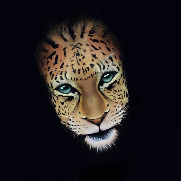 Face painted with detailed leopard makeup art, showcasing one of the incredible makeup looks by talented artists.