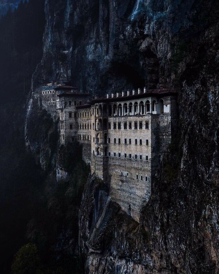 Historic monastery built into steep cliffside, showcasing a unique side of history not found in textbooks.