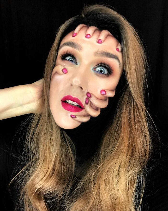Creative makeup look featuring realistic hand designs on the face, showcasing incredible makeup looks by talented artists.