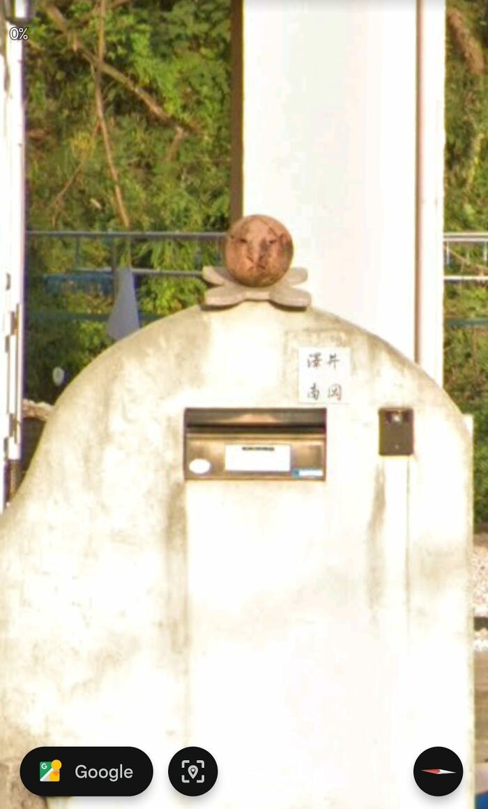 Unusual concrete structure with a round stone sculpture atop, one of the odd things found on Google Earth shared online.