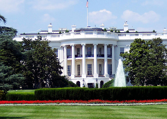 The White House exterior with gardens and fountain, representing Gen X had the best of both worlds era.