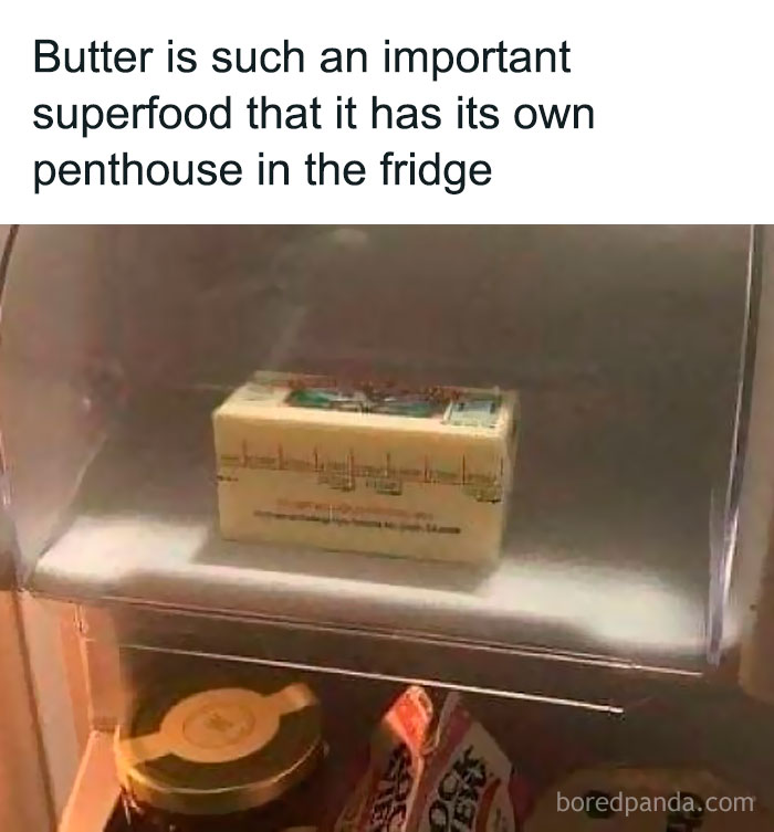 Stick of butter in a fridge compartment with a humorous meme about butter as an important superfood and its storage.