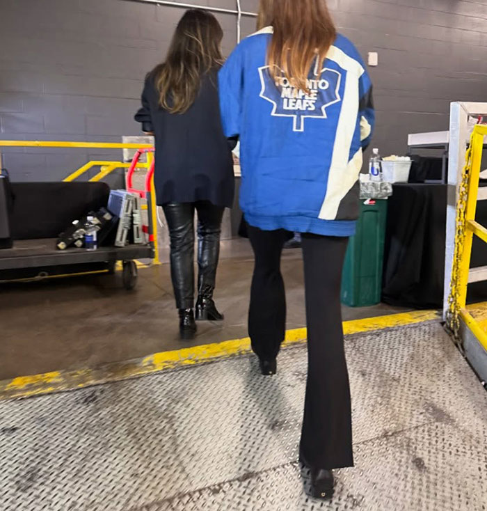 Hailey Bieber walking indoors wearing a Toronto Maple Leafs jacket after husband Justin’s hockey game tantrum. Hailey Bieber walking indoors wearing a Toronto Maple Leafs jacket after husband Justin’s hockey game tantrum.