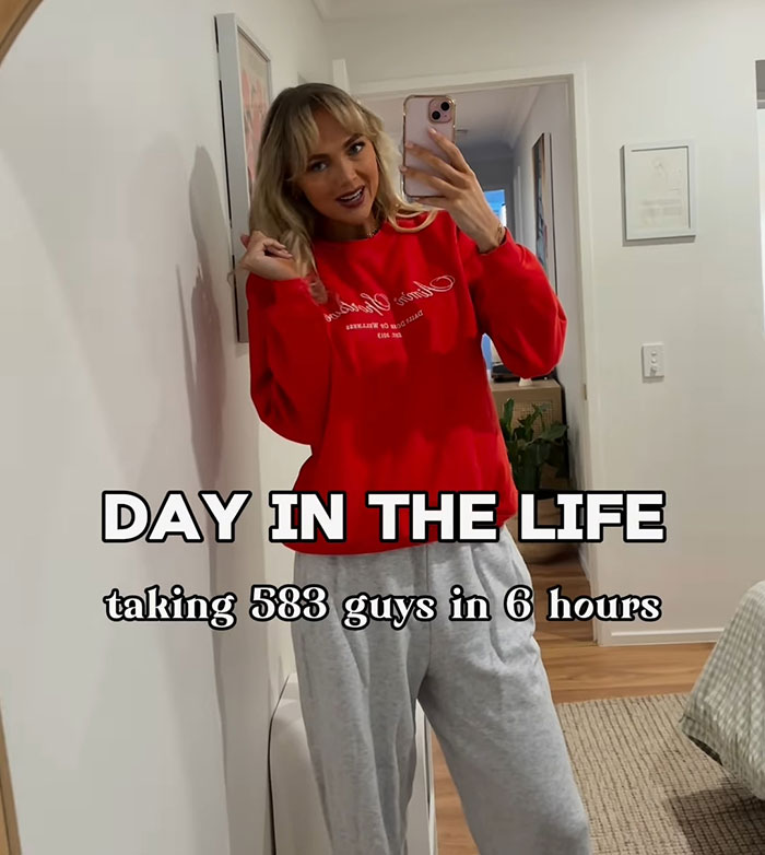 Adult content creator in red sweatshirt shares hospital update after sleeping with 583 men in 6 hours.