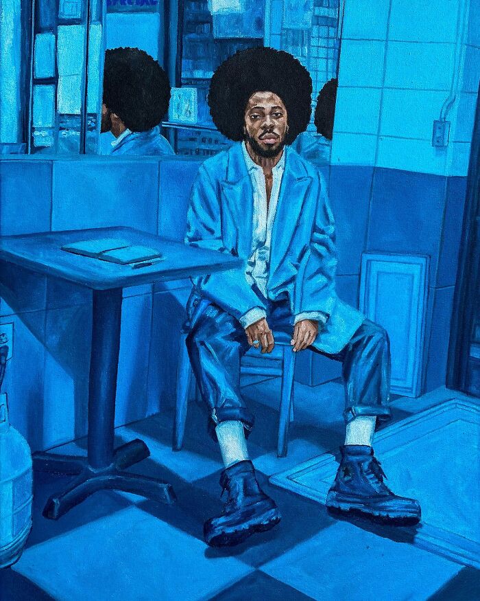 Man with afro in blue tones sitting in a space-themed painting exploring colours and identity in contemporary art.
