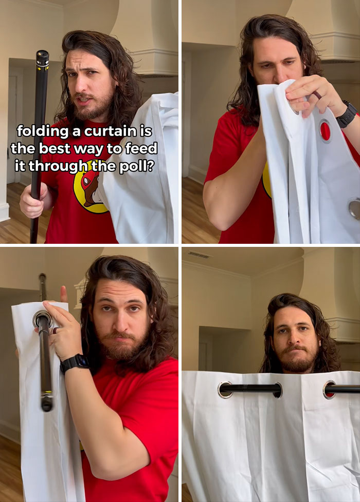 Man demonstrating how to fold a curtain to easily feed it through a curtain rod in a home setting.