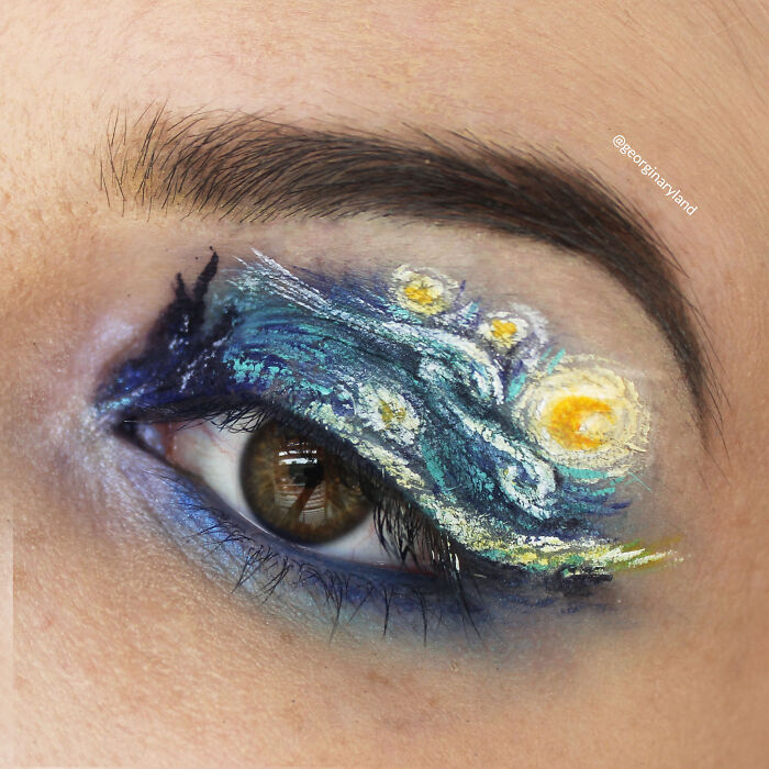 Eye makeup inspired by Starry Night painting featuring intricate blue and yellow swirls and talented makeup artistry.