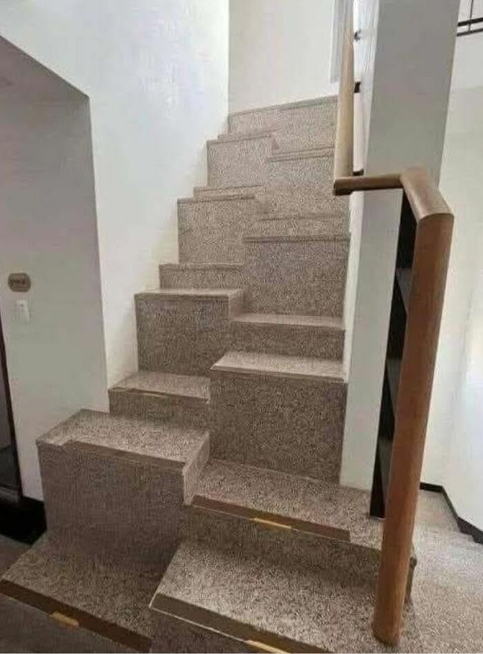 Uneven staircase with unusual design found in homes with hidden or haunted pasts, showcasing strange architectural features.