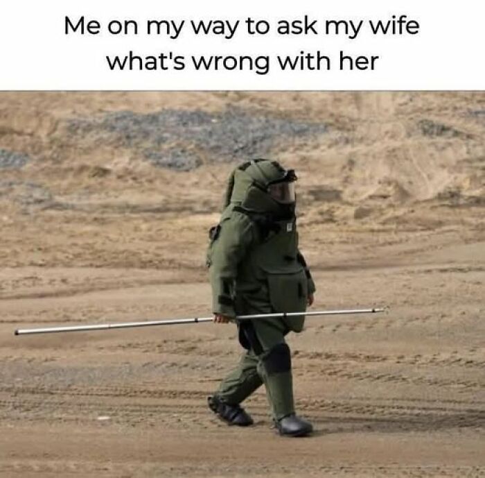 Person in a b**b disposal suit walking on dirt, humorously captioned about approaching a tense conversation, vegan memes theme.