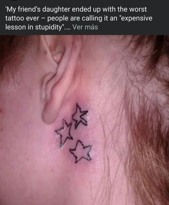 Tattoo with three poorly drawn stars behind the ear, an example of people getting inked but ending up with a permanent mistake.