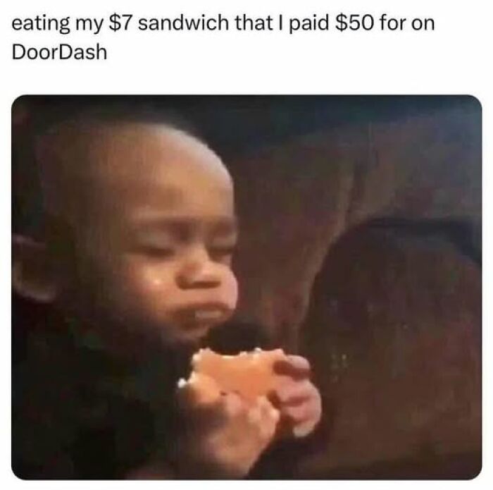 Baby with a serious face eating a sandwich, illustrating sarcastic humor in memes shared on a popular Facebook account.