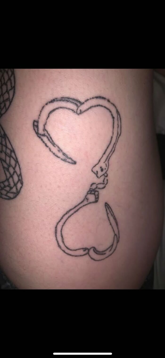 Tattoo of a broken stethoscope forming a heart shape, illustrating a permanent mistake in inked designs.