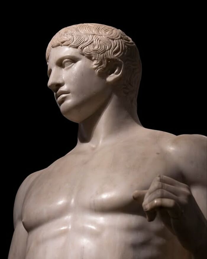 Close-up of an ancient marble statue showcasing detailed archeology and art from classical antiquity.