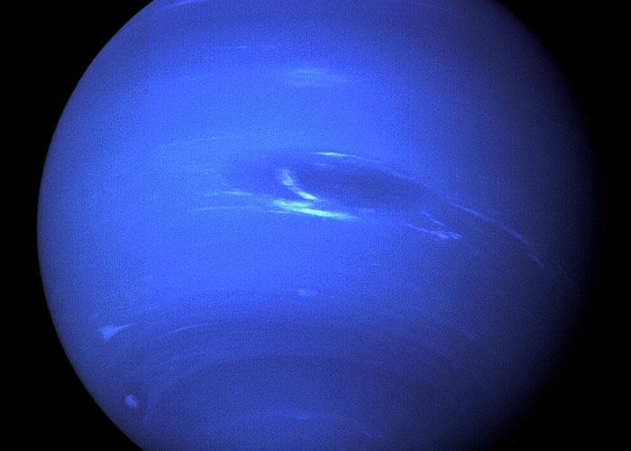 Close-up of the blue planet Neptune, highlighting its swirling clouds and atmospheric details for entertaining facts.