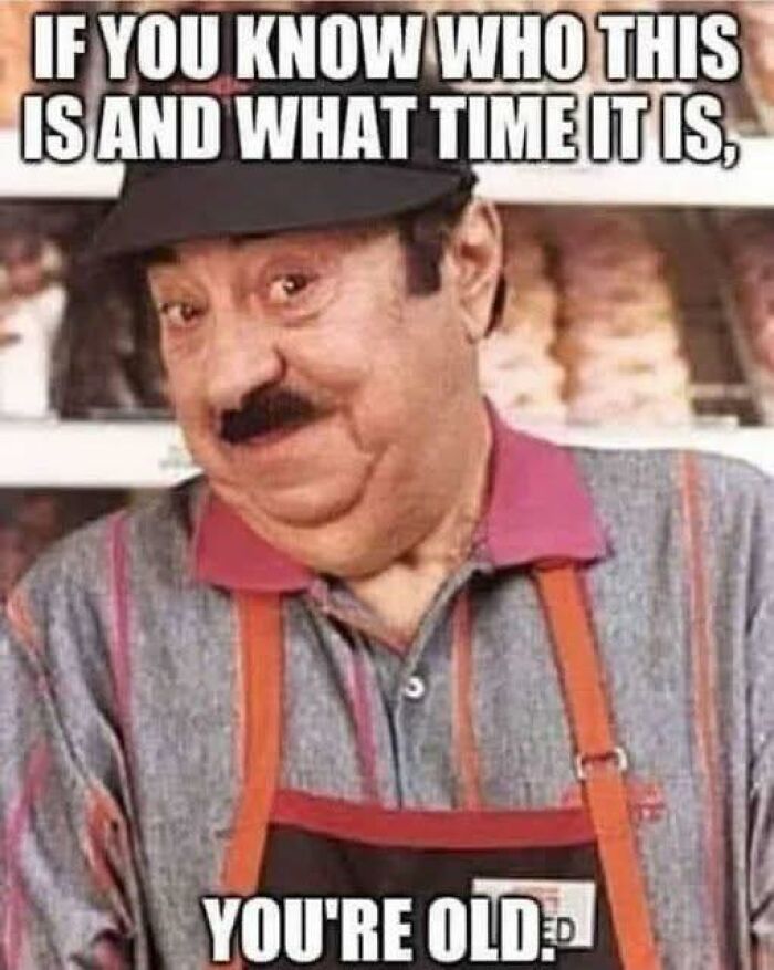 Older man in a store apron with a humorous expression, a funny post popular for sharing with friends online.