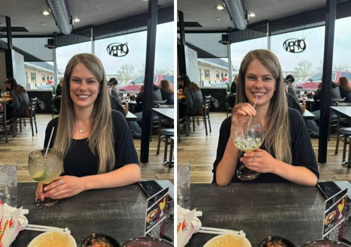 Woman sitting at a restaurant table holding oversized drinks, showcasing hilarious Photoshop edits by an artist.