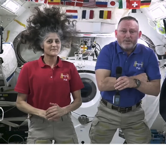 Two astronauts aboard the space station sharing their experiences after spending 286 days in space facing physical struggles