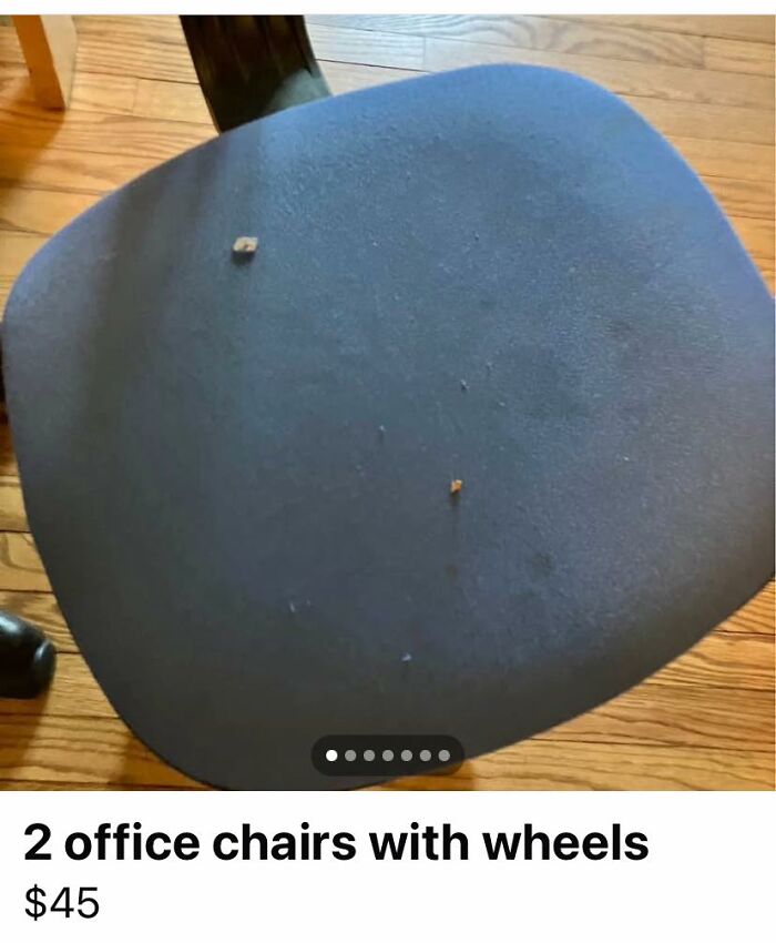 Worn office chair seat with small stains on wooden floor, one of the wildest things found for sale on Facebook Marketplace.