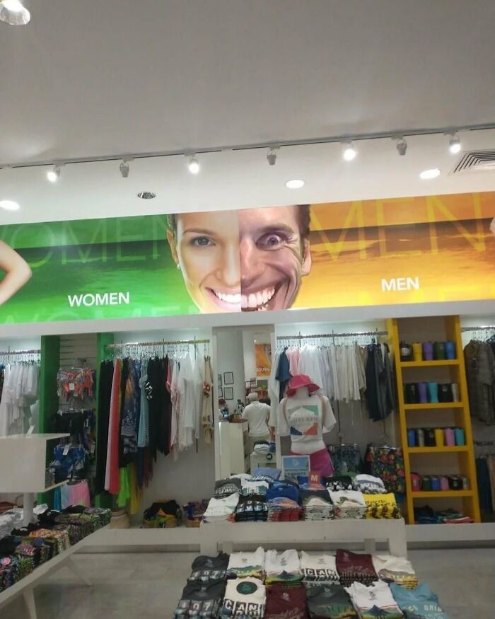 Clothing store with separate women and men sections, featuring a chaotic meme face split between the two signs.