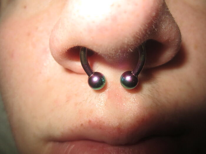 Close-up of a nose with a septum piercing, illustrating unique boomer opinions that people actually agree with.