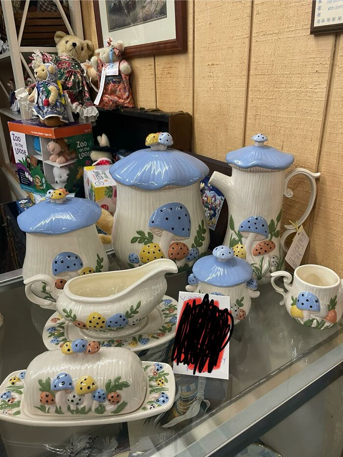 Vintage ceramic kitchen set with blue mushroom designs and colorful accents in a thrifted finds collection display.